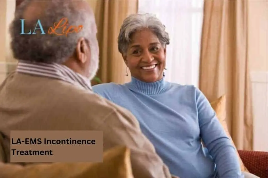 Couple sat smiling at each other - LA-EMS treatment Farnham