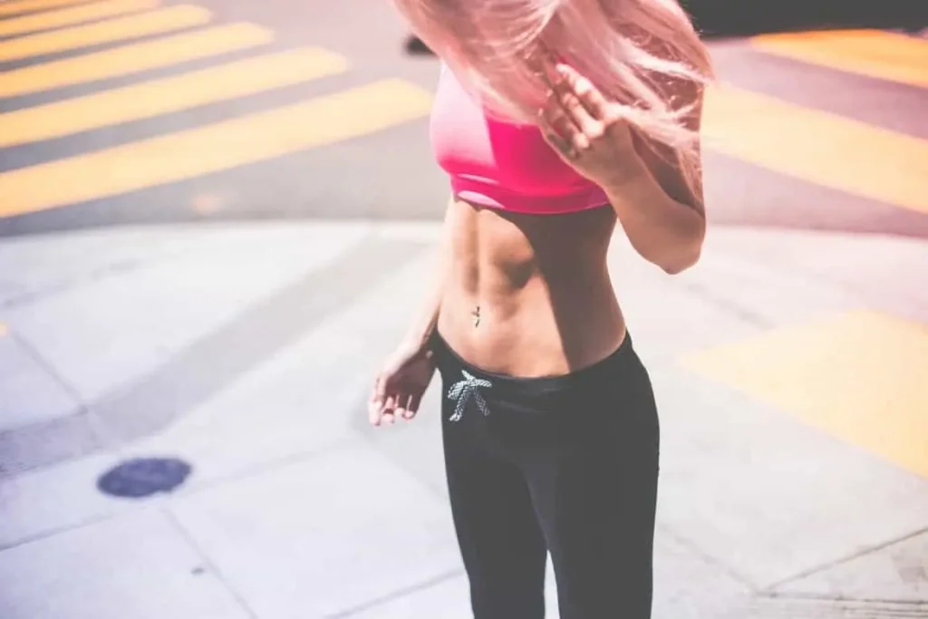 Woman with toned stomach after LA-EMS Body Sculpting Treatment Farnham